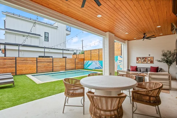 a outdoor space with a table and chairs