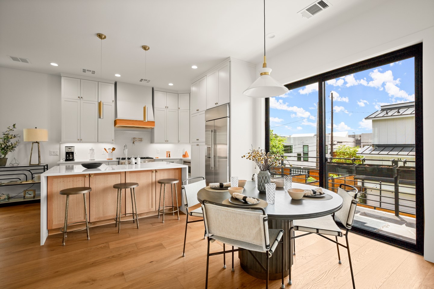 2005 East 8th Street, Unit A Austin, TX 78702 - Photo 6 of 36 a kitchen with a table chairs stove and kitchen view