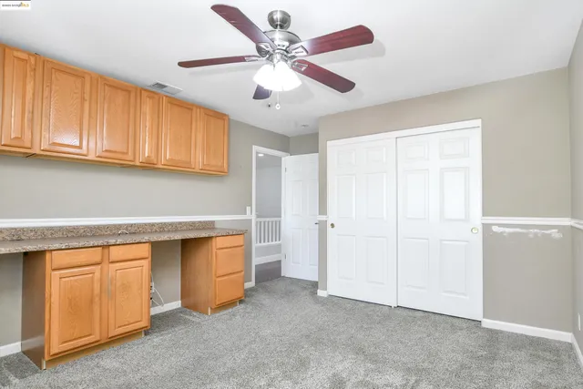 a view of a patio with table and chairs and wooden floor