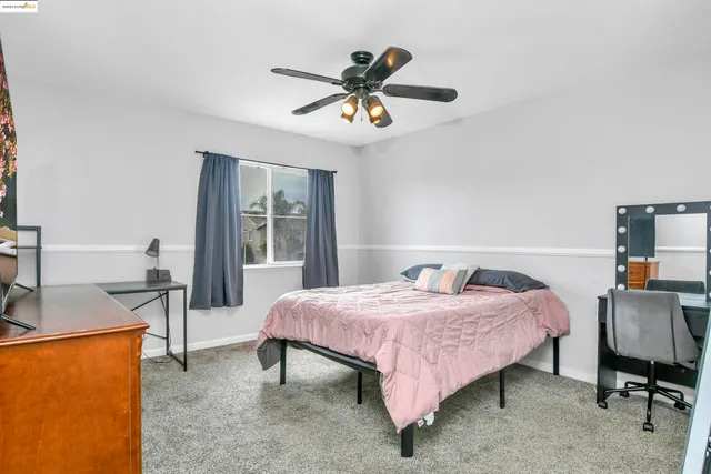 a view of a patio with couches and a fireplace