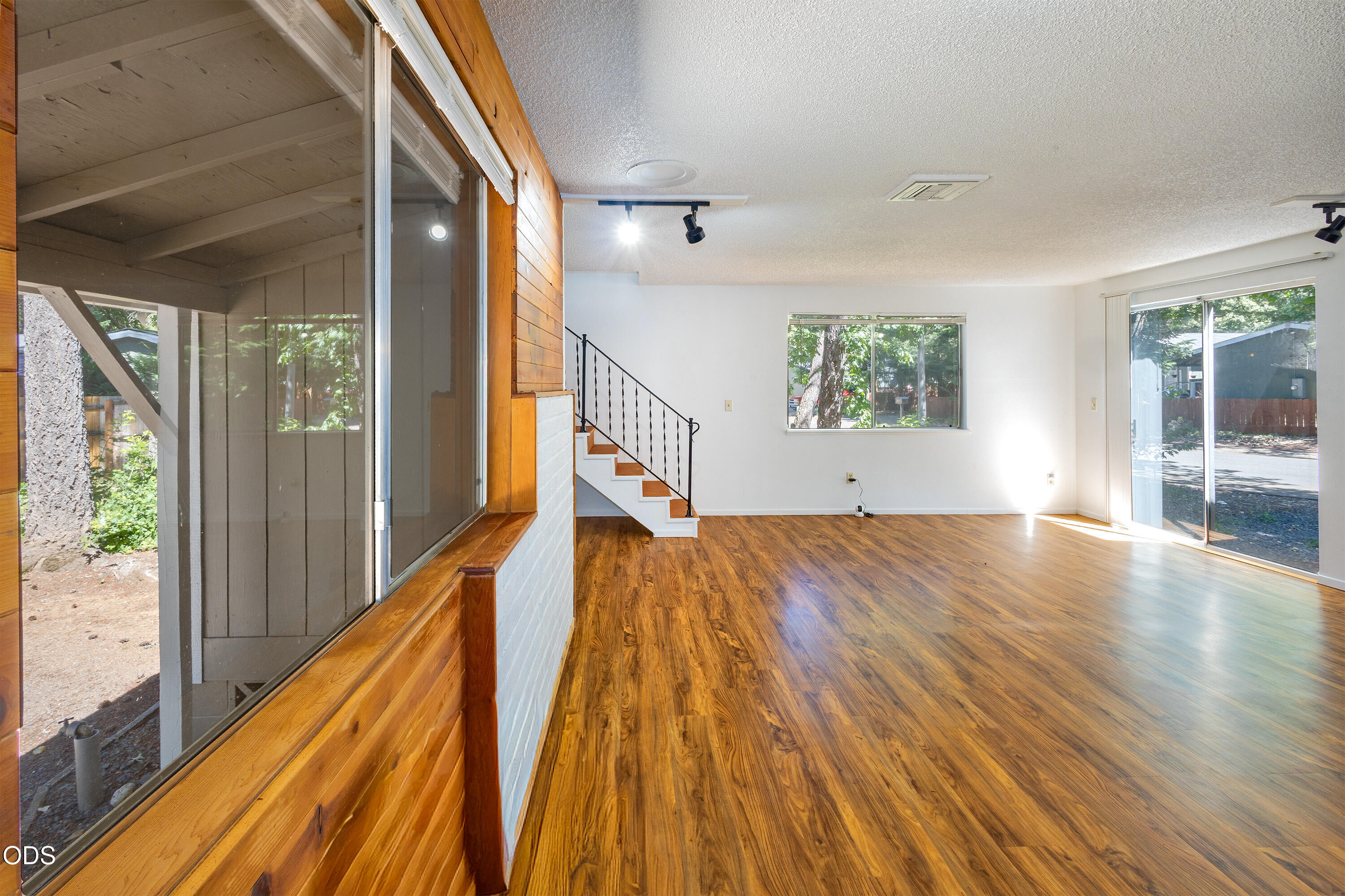 315 South Old Stage Road Cave Junction, OR 97523 - Photo 8 of 29 a view of empty room with wooden floor and fan