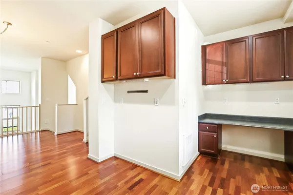 a view of entryway with wooden floor