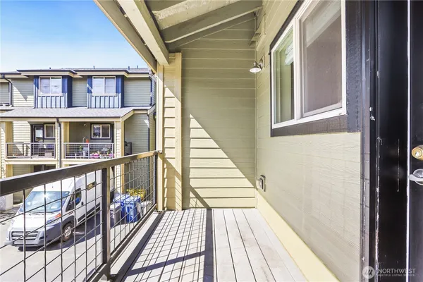 a view of balcony with wooden floor