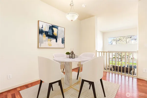 a view of a dining room with furniture and wooden floor
