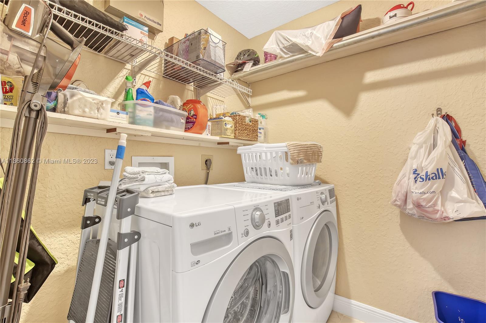 119 Ocean Dunes Circle Jupiter, FL 33477 - Photo 16 of 39 a utility room with dryer and washer
