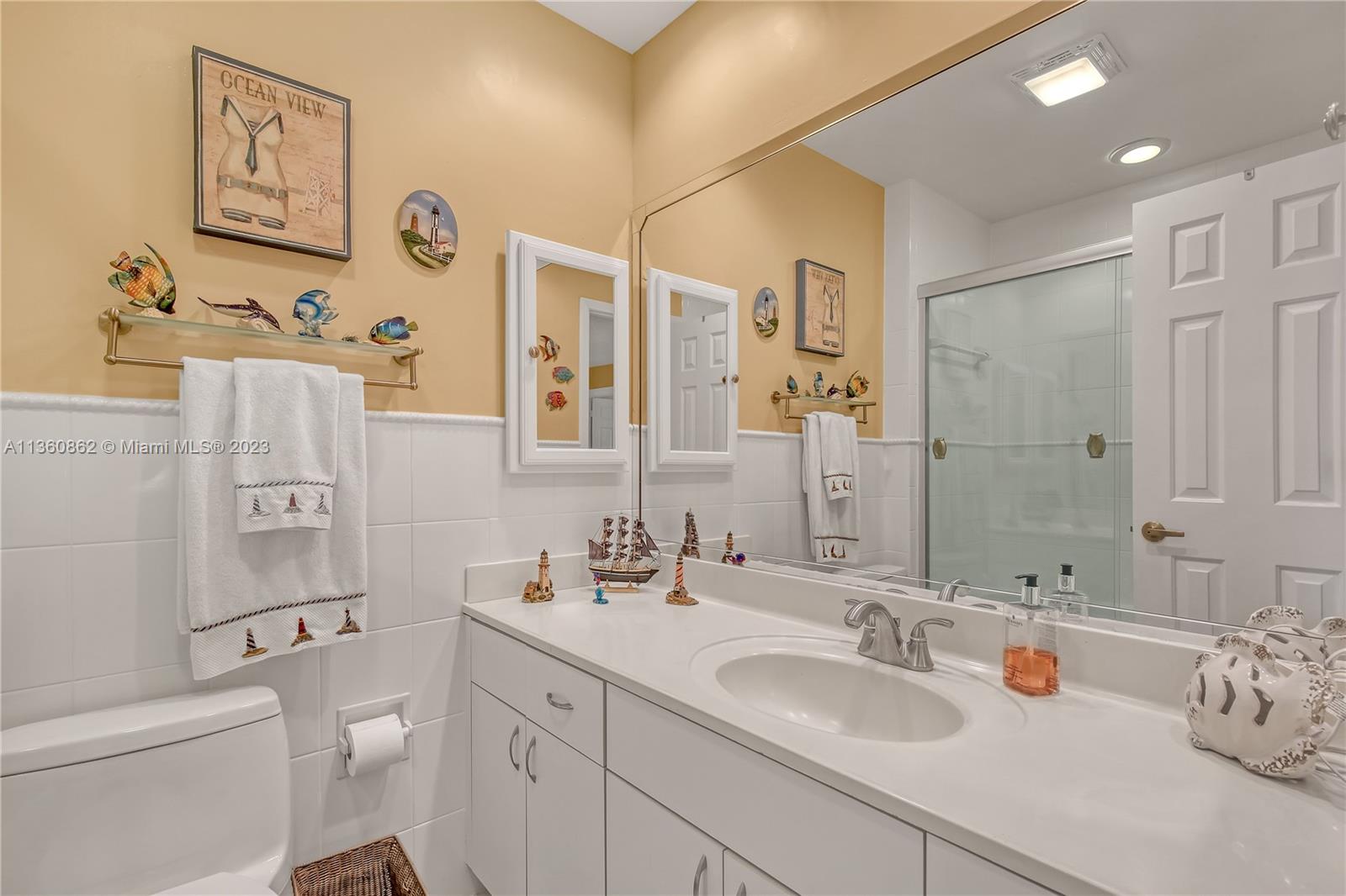 119 Ocean Dunes Circle Jupiter, FL 33477 - Photo 24 of 39 a bathroom with a sink toilet tub and shower