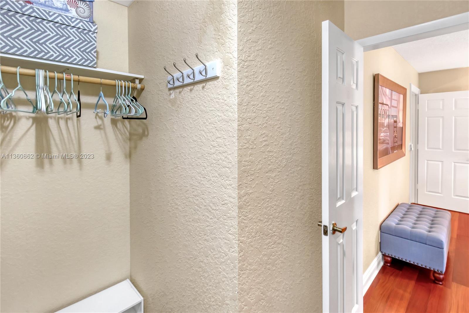 119 Ocean Dunes Circle Jupiter, FL 33477 - Photo 29 of 39 a bedroom with a bed and a wooden floor