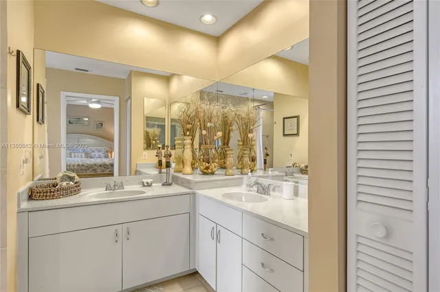 a bathroom with a sink double vanity and a mirror
