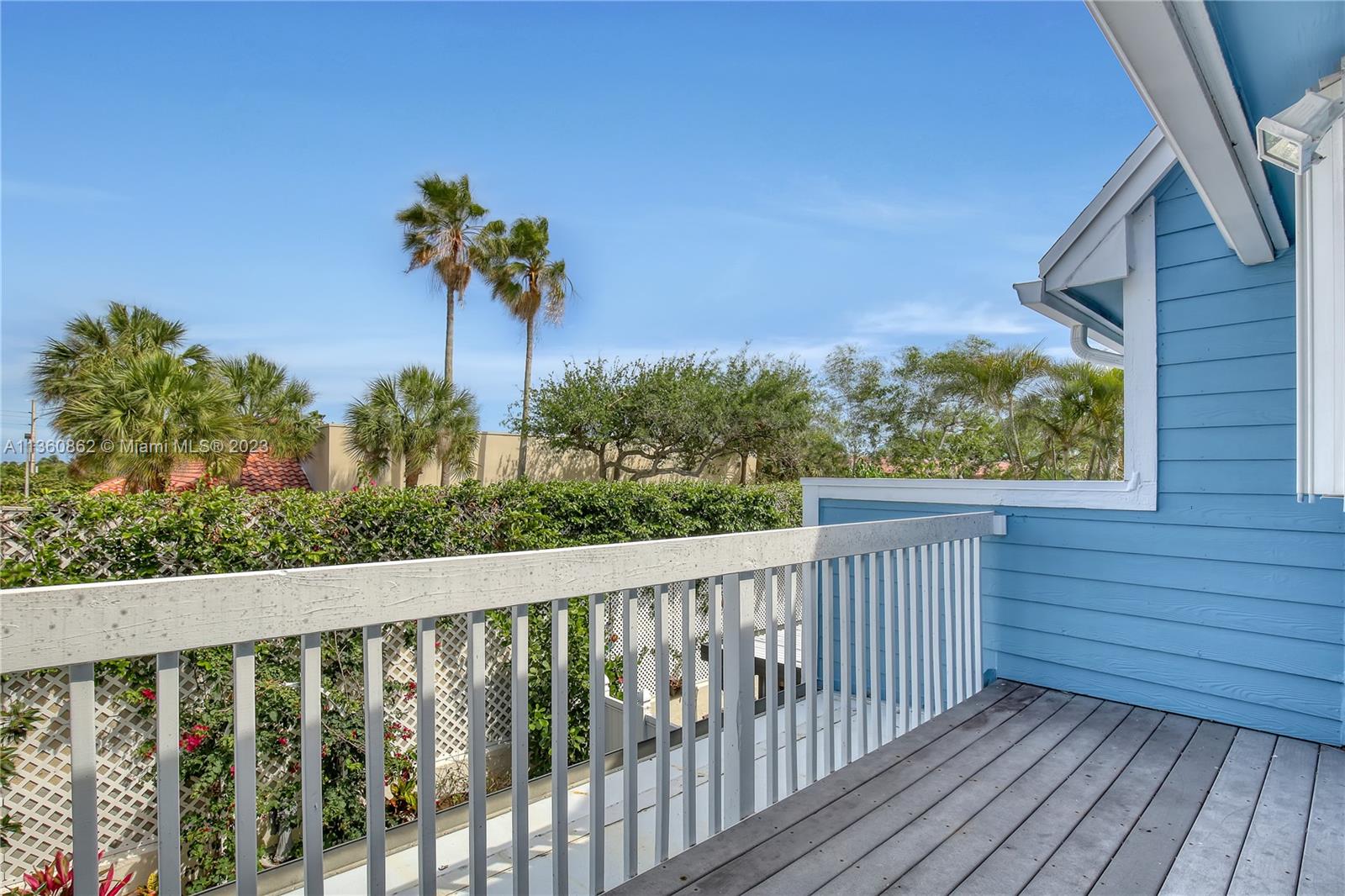 119 Ocean Dunes Circle Jupiter, FL 33477 - Photo 34 of 39 a view of a balcony with flower plants