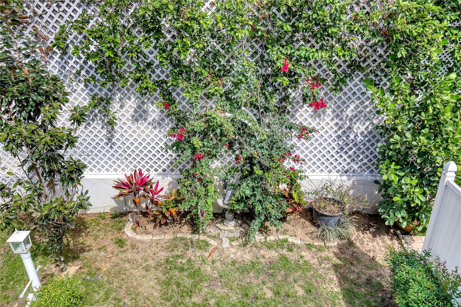 119 Ocean Dunes Circle Jupiter, FL 33477 - Photo 35 of 39 a view of a flower in a yard
