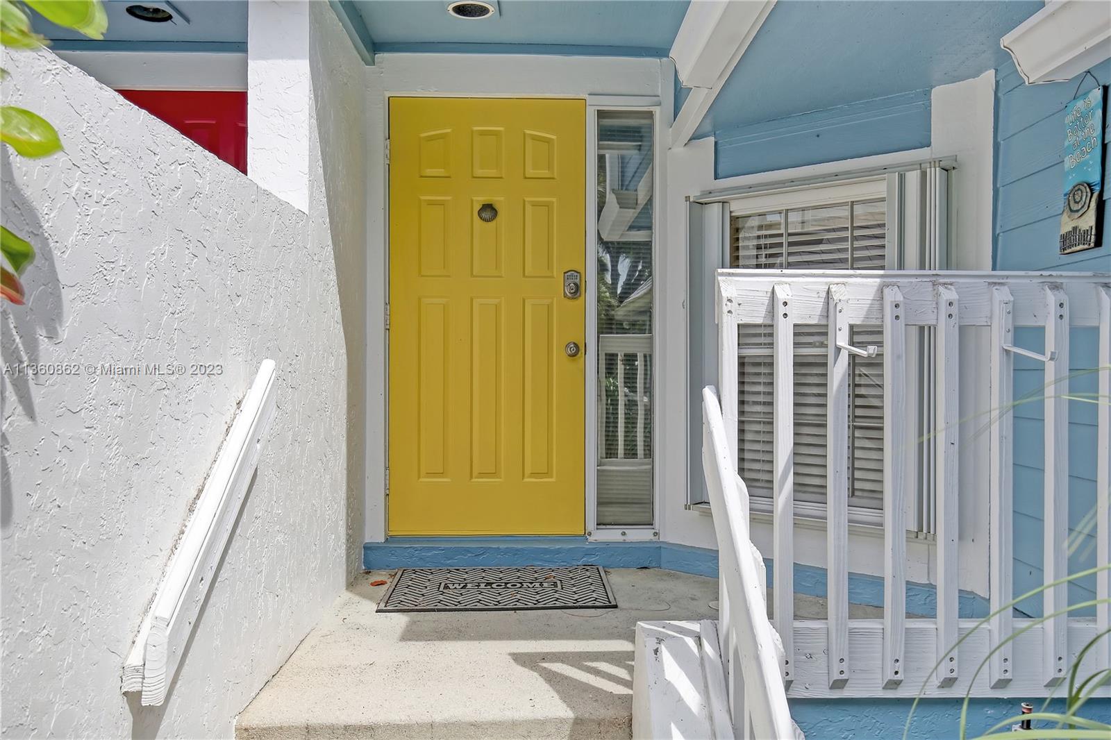 119 Ocean Dunes Circle Jupiter, FL 33477 - Photo 4 of 39 a view of front door of house