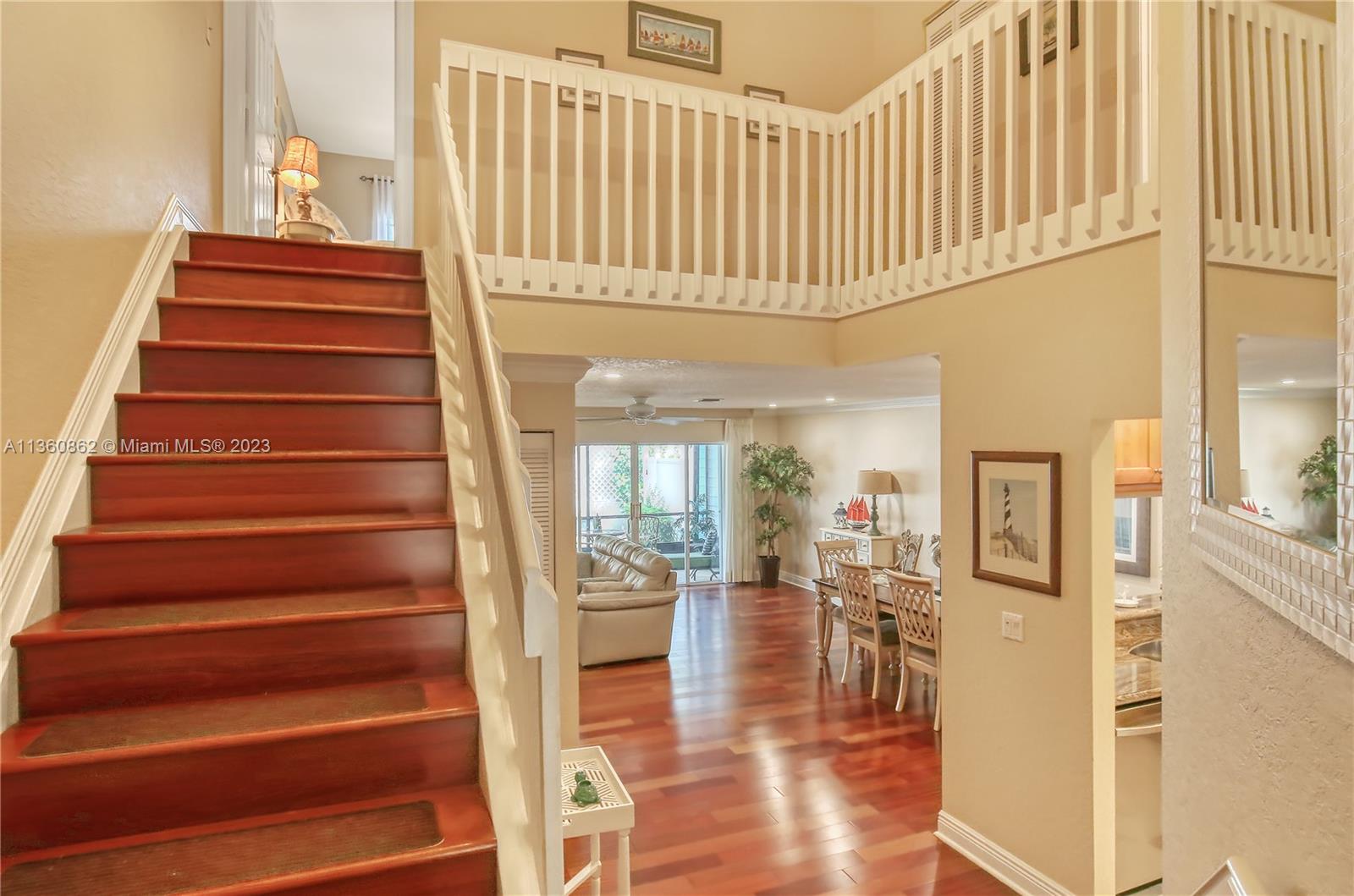 119 Ocean Dunes Circle Jupiter, FL 33477 - Photo 6 of 39 a view of entryway and hall with wooden floor