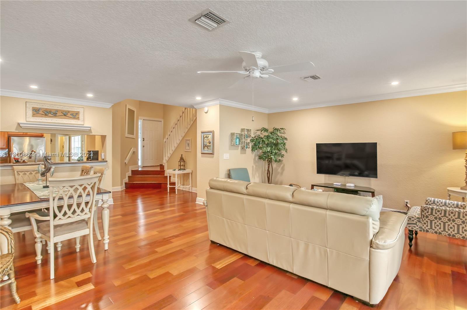 119 Ocean Dunes Circle Jupiter, FL 33477 - Photo 8 of 39 a living room with furniture and a flat screen tv