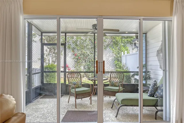 a view of a room with furniture and a window