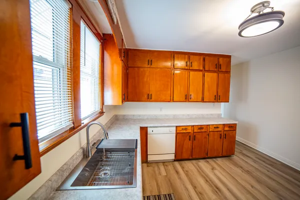 a view of a room with wooden floor and chair