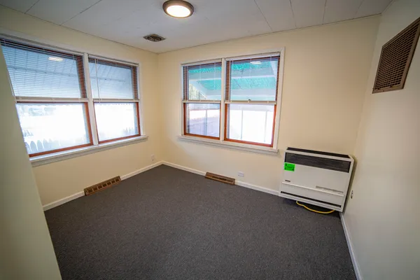 an empty room with windows