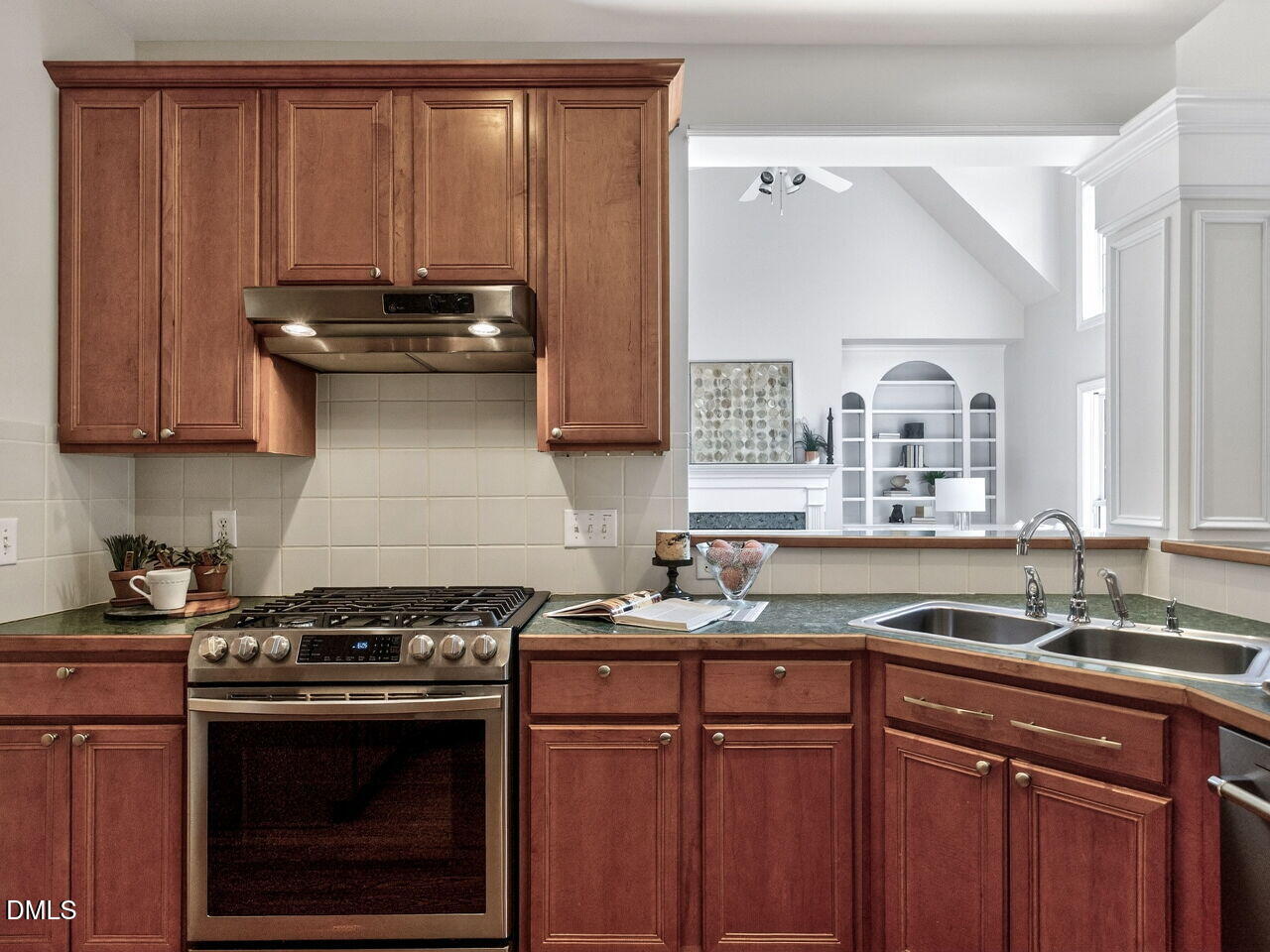 6232 Big Sandy Drive Raleigh, NC 27616 - Photo 19 of 39 a kitchen with a sink stove and cabinets