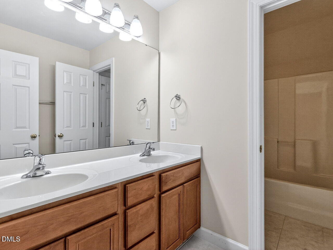 6232 Big Sandy Drive Raleigh, NC 27616 - Photo 31 of 39 a bathroom with a sink double vanity and a mirror