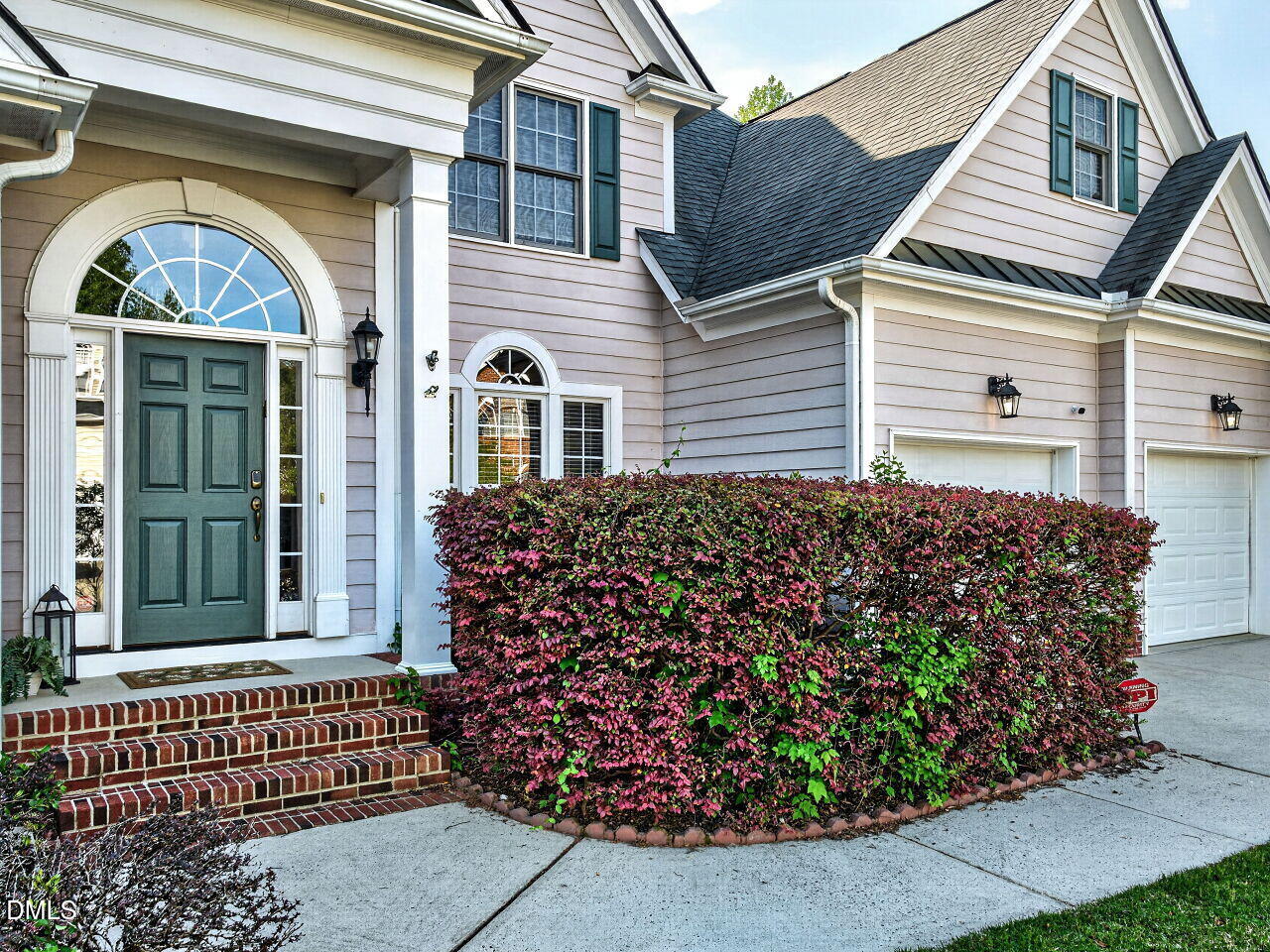 6232 Big Sandy Drive Raleigh, NC 27616 - Photo 4 of 39 a front view of a house with a garden