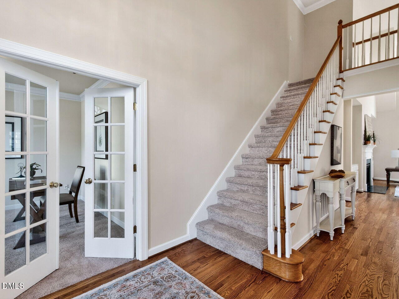 6232 Big Sandy Drive Raleigh, NC 27616 - Photo 7 of 39 a view of an entryway with wooden floor and windows