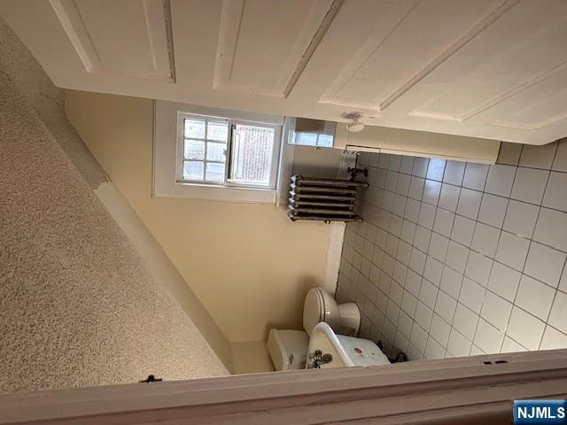 15 Albion Street Passaic, NJ 07055 - Photo 22 of 23 a bathroom with a vanity and toilet
