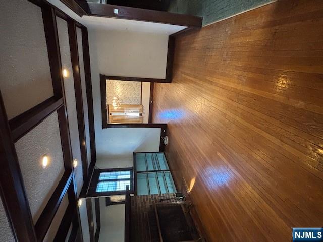 15 Albion Street Passaic, NJ 07055 - Photo 3 of 23 a view of an empty room with wooden floor and a window