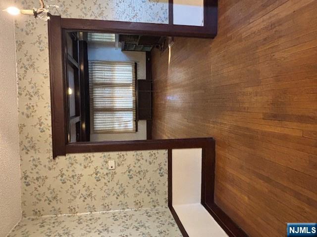 15 Albion Street Passaic, NJ 07055 - Photo 5 of 23 a view of empty room with wooden floor and fan