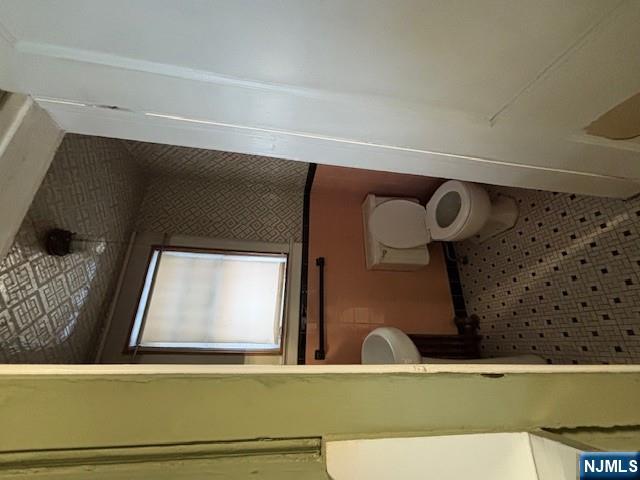 15 Albion Street Passaic, NJ 07055 - Photo 7 of 23 a bathroom with a toilet and a shower