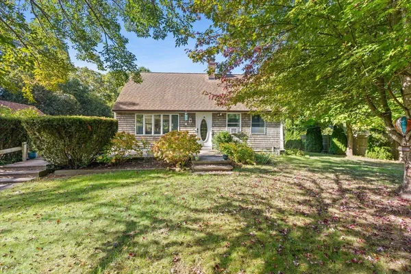 front view of a house with a yard