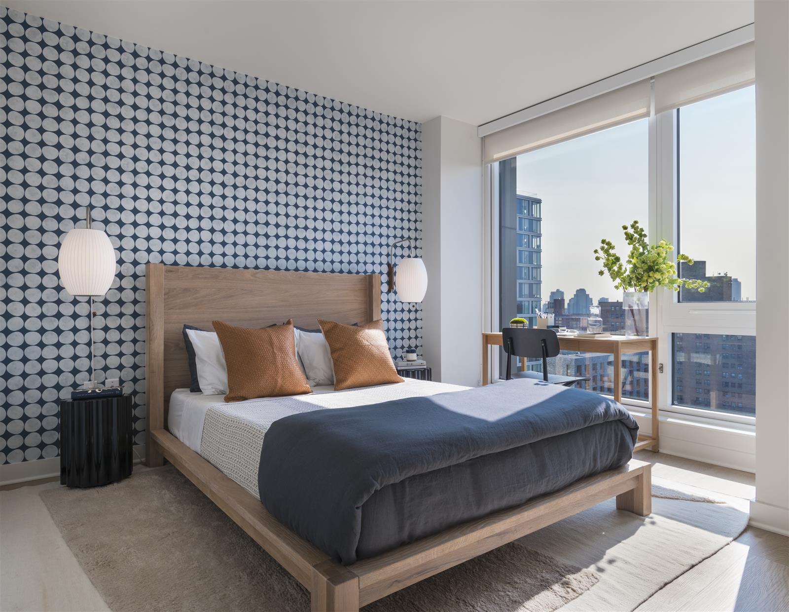 55 Suffolk Street, Unit PH203 Manhattan, NY 10002 - Photo 4 of 15 a bedroom with a bed lamp and window