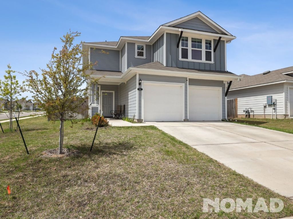 a house view with a backyard space