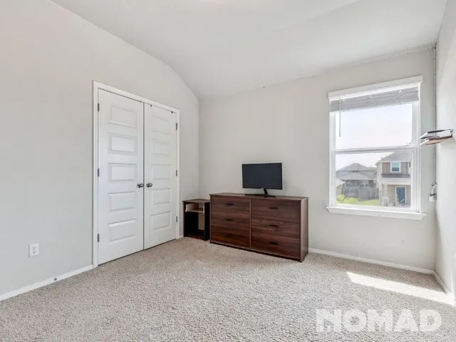 a view of room with furniture and windows