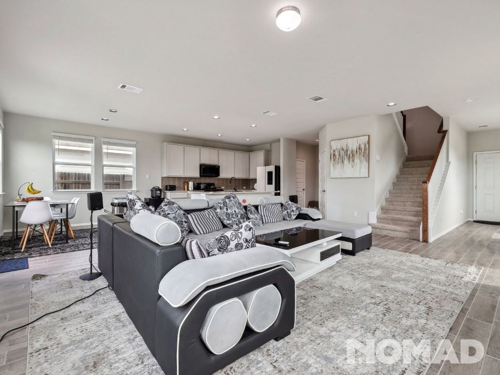 101 Crescent Street Georgetown, TX 78626 - Photo 5 of 28 a living room with furniture a large window and chairs