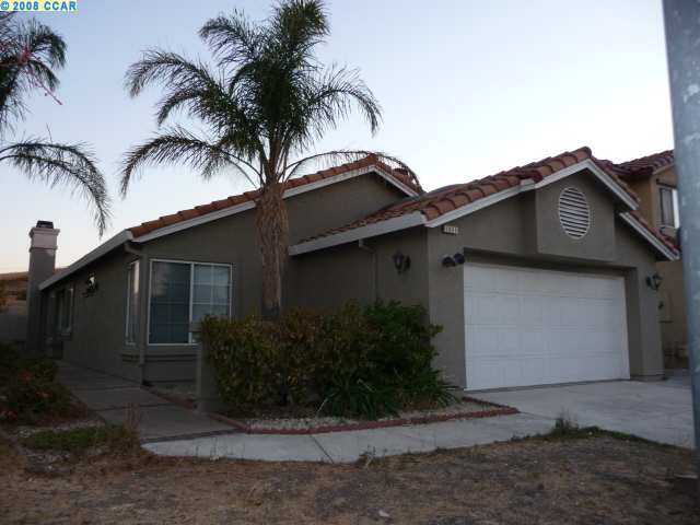 1059 St Raphael Drive Bay Point, CA 94565 - Photo 1 of 1 a house that has a palm tree in front of it