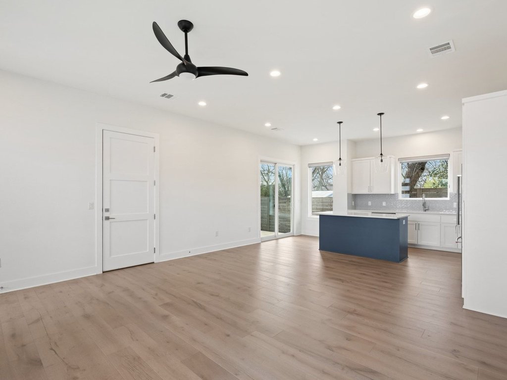 709 West St Elmo Road, Unit 2 Austin, TX 78745 - Photo 11 of 26 Unfurnished living room with ceiling fan, light wood-style flooring, and recessed lighting
