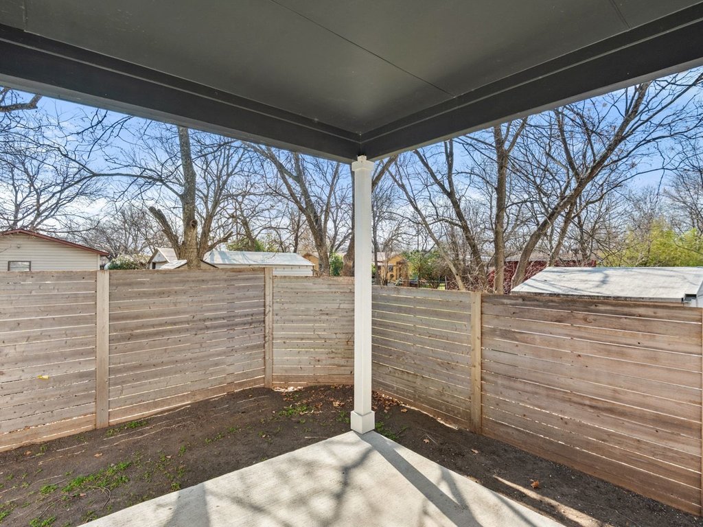 709 West St Elmo Road, Unit 2 Austin, TX 78745 - Photo 22 of 26 Fenced backyard with a patio area