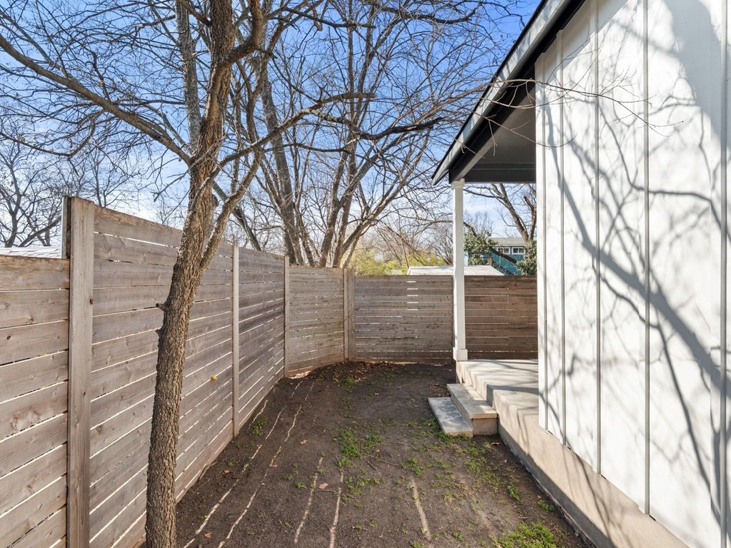 709 West St Elmo Road, Unit 2 Austin, TX 78745 - Photo 23 of 26 View of fenced backyard