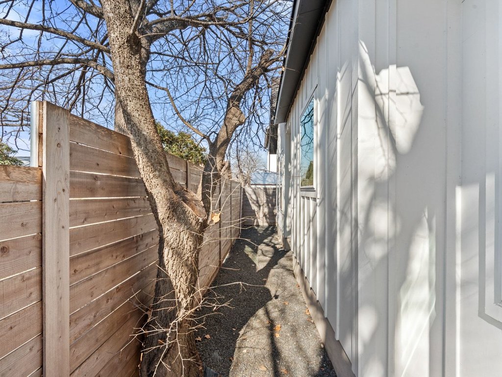 709 West St Elmo Road, Unit 2 Austin, TX 78745 - Photo 24 of 26 View of property exterior featuring a fenced backyard