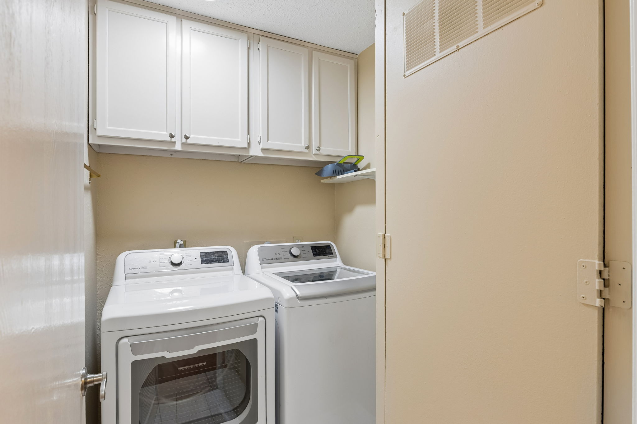 8340 Fathom Circle, Unit 103 Austin, TX 78750 - Photo 24 of 30 a utility room with dryer and washer