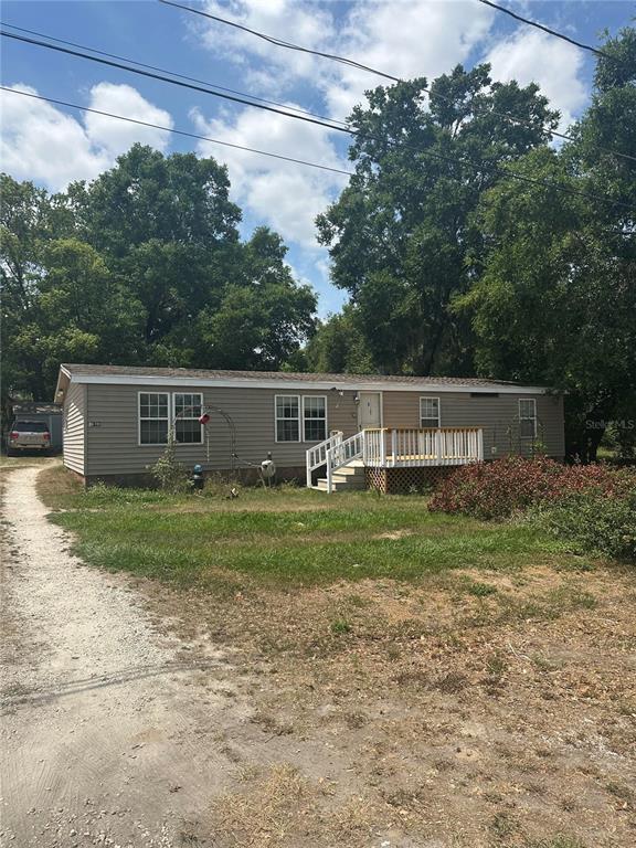 16780 Southeast 101st Ct Road Summerfield, FL 34491 - Photo 1 of 1 a view of a house with a yard