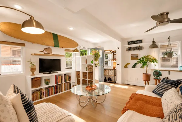 a living room with furniture and a flat screen tv