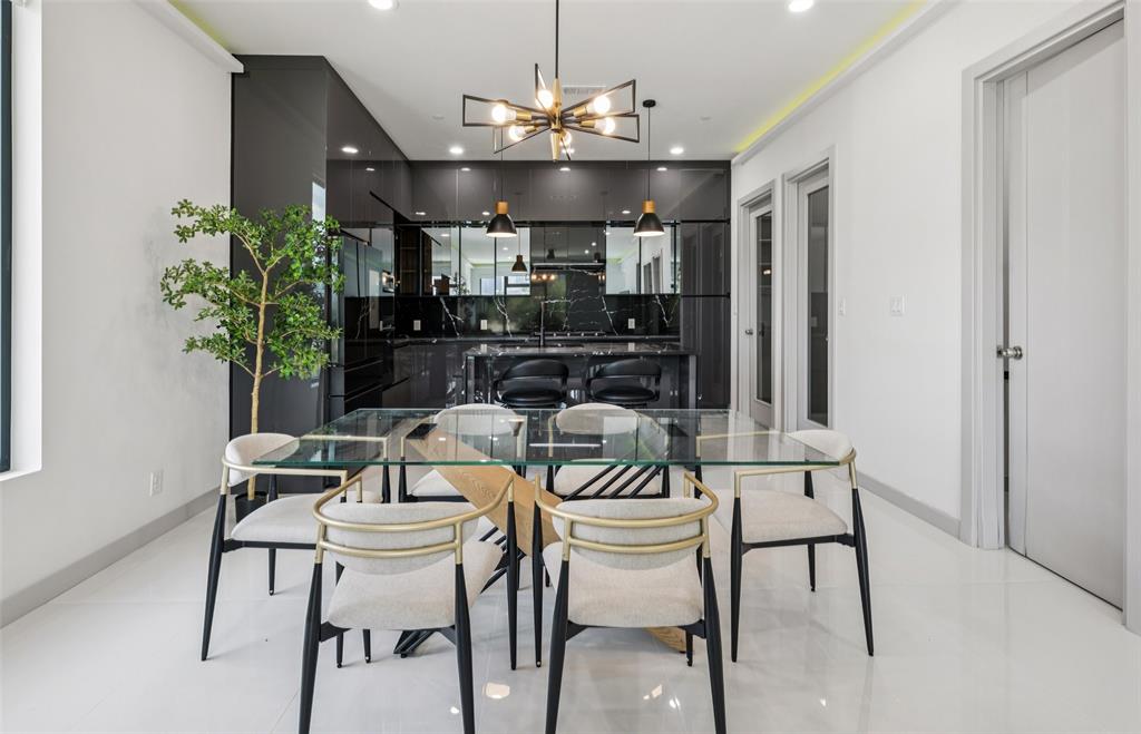 1874 Beaumont Street Dallas, TX 75215 - Photo 12 of 38 a view of a dining room with furniture and chandelier