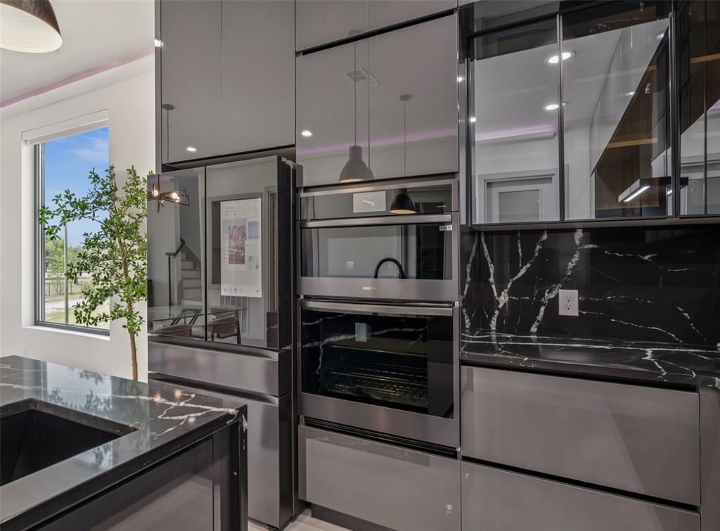 1874 Beaumont Street Dallas, TX 75215 - Photo 17 of 38 a kitchen with granite countertop a sink and stainless steel appliances