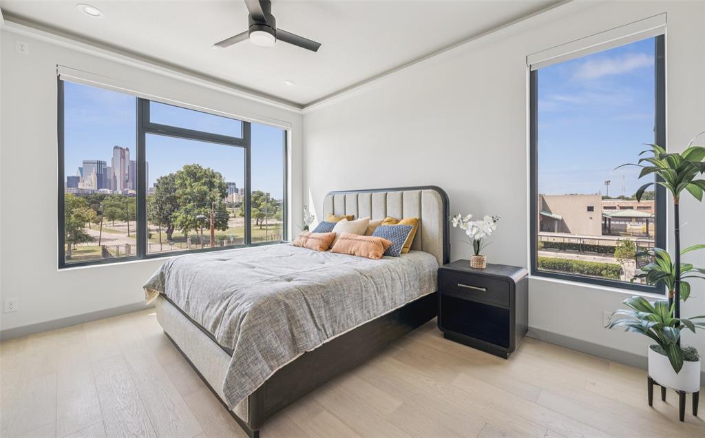 1874 Beaumont Street Dallas, TX 75215 - Photo 19 of 38 a large bed sitting in a bedroom next to a window