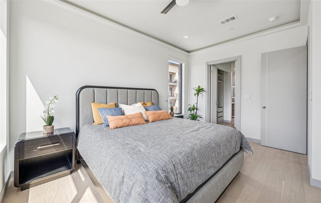 1874 Beaumont Street Dallas, TX 75215 - Photo 20 of 38 a bedroom with a bed and a couch