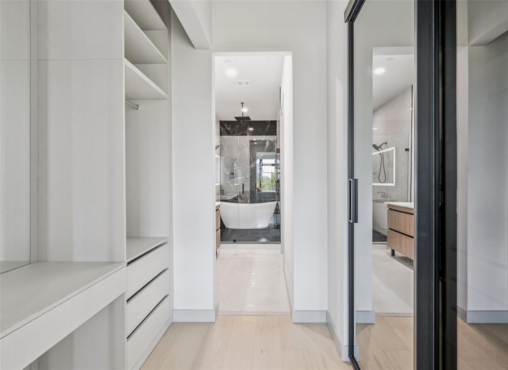 1874 Beaumont Street Dallas, TX 75215 - Photo 23 of 38 a view of a hallway with wooden floor and a bathroom