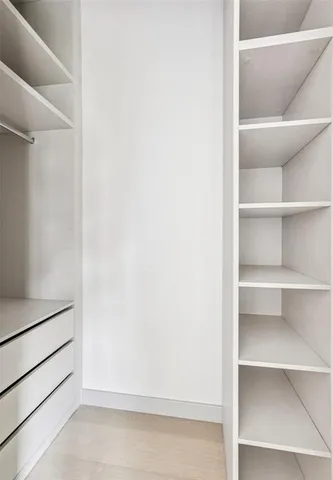 a view of an empty walk in closet