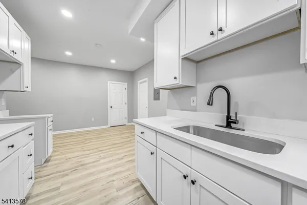 a kitchen with a sink and cabinets