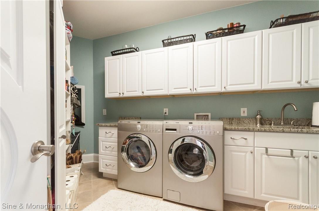 69621 Wildflower Lane Romeo, MI 48065 - Photo 13 of 32 Large laundry room steps from the kitchen