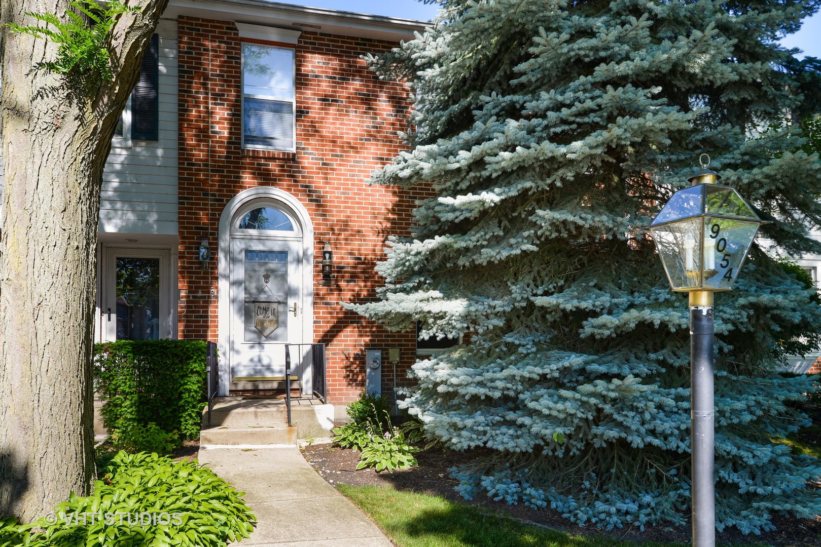 9054 Forestview Road Evanston, IL 60203 - Photo 1 of 24 a front view of a house with a yard
